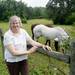 Lorie Armbruster poses for a photo with her horses at her Saline Township home. The Armbrusters have been struggling with the Paxton Resources over whether to give up their mineral rights in a lease with the company, or be forced to give them up in a state hearing. Melanie Maxwell | AnnArbor.com